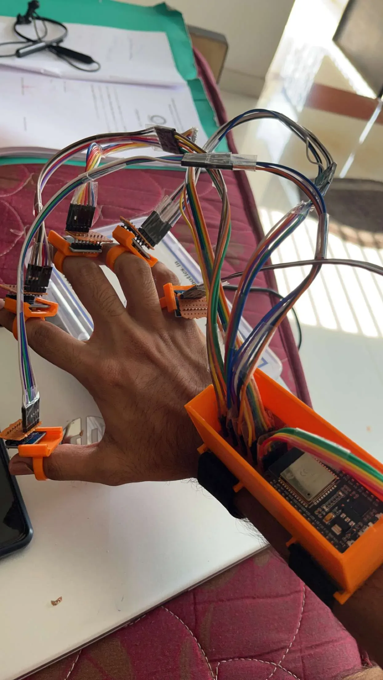 Close-up of Voicer IMU sensors worn as finger rings